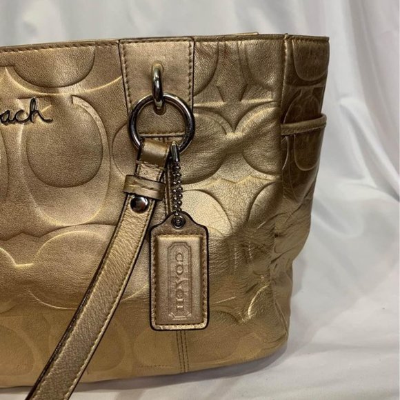 COACH gold handbag. Purple lining. Embedded coach logo. Big outside pock… - Picture 2 of 10